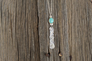 Turquoise pendant with engraved bar