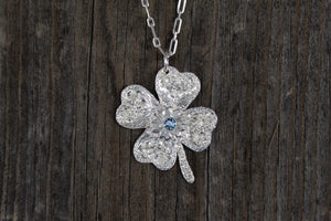 Shamrock with flower and stone