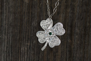Shamrock with flower and stone