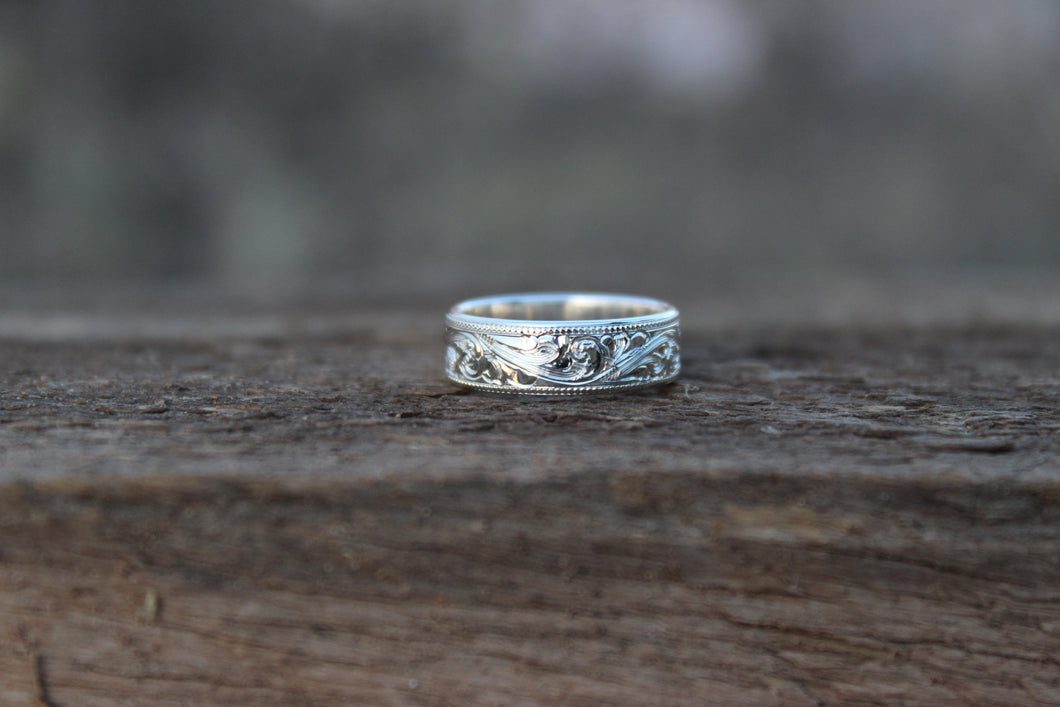Solid sterling silver and hand engraved 5mm comfort band with milgrain